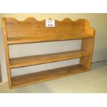 A set of open pine wall shelves and a sm