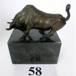 A hot-cast bronze model of a bull on mar