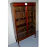 An Edwardian mahogany display cabinet wi