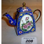 A small enamelled teapot 'Trade & Aid' e