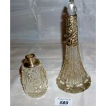 A cut glass scent bottle with silver col
