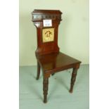 A fine 19c mahogany hall chair with an i