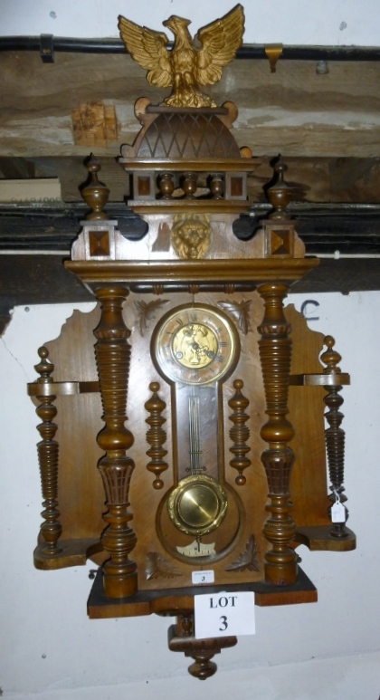 A continental walnut regulator with eagl