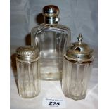 A panel cut hip flask with silver top Lo