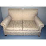 An early 20c two seater sofa re-upholste