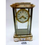 A 19th century French beige marble and gilt brass 'four glass' mantle clock with painted enamel