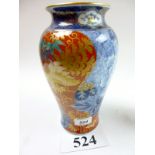 A Japanese blue and white vase painted with birds and flowers in reds,