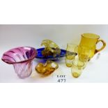 An amber glass jug and tumblers,