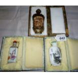 A collection of three Chinese snuff bottles to include a signed ceramic snuff bottle decoration