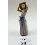 A small Lladro figurine of a young woman est: £20-£40 (O1)