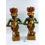 A pair of decorative polychrome carved wooden Indian drummer figures (62 cm high approx) est: