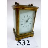 An early 20th century French gilt brass carriage clock with Roman numerals,