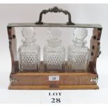 A three decanter oak Tantalus (key with auctioneer) est: £50-£80 (A1)