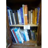 A collection of books mostly related to Naval war-fare arranged over two shelves est: £20-£40 (D5)