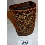 A Chinese horn carved cup decorated with dragons est: £50-£70