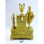 A 19th Century Empire neoclassical style ormolu mantle clock profusely engraved and adorned with