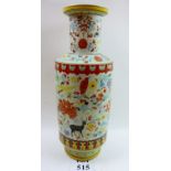 A large oriental pottery vase decorated in coloured enamels with birds and deer amongst flowers and