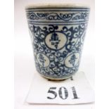 A Chinese pottery blue and white brush pot decorated with script and a scrolling ground est: