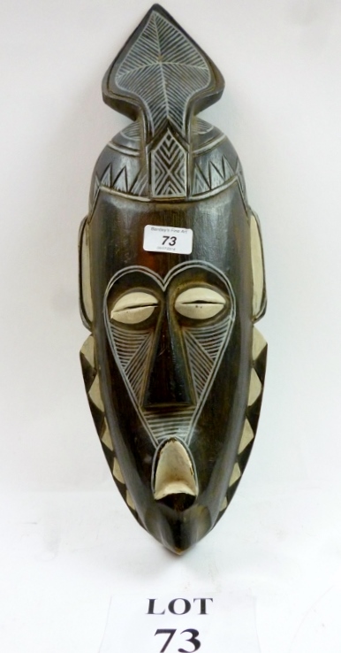 An African carved wood and white painted face mask est: £50-£80 (K2)