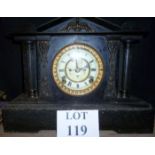 A Victorian black marble mantel clock wi