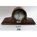 A small Edwardian helmet mantel clock es