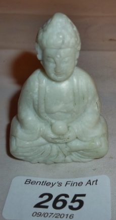 A Chinese white jade Buddha pendant est: