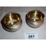 A pair of Victorian silver circular salt