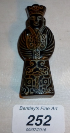 A Chinese jade pendant in the form of a