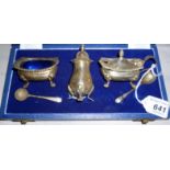 A silver three piece condiment set with