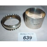 A pair of silver napkin ring both fully