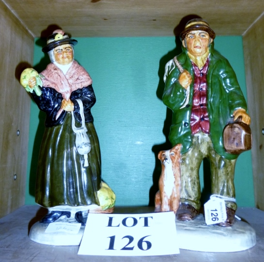 A pair of Staffordshire Roy Kirkham figu