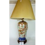 A large decorative Chinese blue and white lamp base decorated with figures amongst clouds and