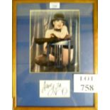 A framed and glazed signed photograph of Liza Minelli signed 'Love Liza' (24 x 19 cm approx) est: