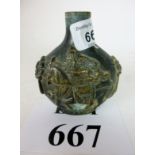 A small Chinese bronze vase or drug jar decorated with horsemen est: £30-£50 (N1)