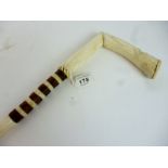 A Sailor art cane with bone and wood carved handle est: £30-£60 (J)