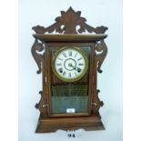 An American Seth Thomas Clock Co walnut cased parlour gingerbread shelf clock,