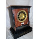 A 19th century French black and red marble mantel clock,