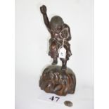A good quality Japanese bronze figural group modelled as a man with a frog on a sea-like base,