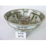 A large decorative Chinese punch bowl all over decorated with figural and floral panels in colours