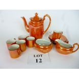 An orange lustre coffee set for five est: £25-£45 (A2)