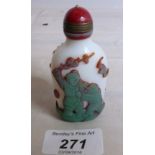 A white overlayed glass snuff bottle with red jade stopper est: £70-£90