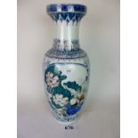 A large Chinese blue and white vase with floral and bird decoration in colours and gilt,