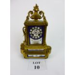 A 19th century French gilt ormolu metal and porcelain panelled mantle clock in the Louis XV manner,