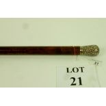 A walking cane with embossed white metal top est: £30-£50 (J)