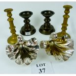 A pair of heavy metal shell dishes and two pairs of brass candlesticks est: £40-£60 (A11)