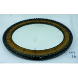 A decorative oval wall mirror est: £30-£50 (C)