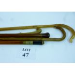 A shepherd's crook and four other walking sticks or canes to include a sword stick est: £40-£60 (J)