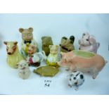 A collection of novelty 'pig' china items to include money box, teapot, jam pot,