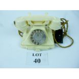 A vintage ivory Bakelite telephone numbered 1/232L S55/2 to base est: £30-£50 (B11)