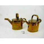 A pair of brass watering cans est: £40-£60 (B36)